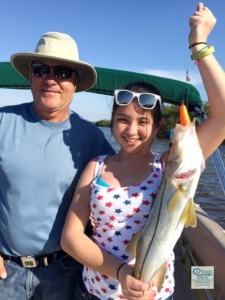 girl holding snook.