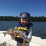 young girl holding a seatrout in PIne Island Sound Sanibel FL