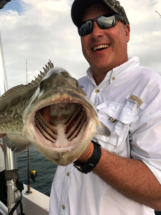 Man holding a Gag Grouper